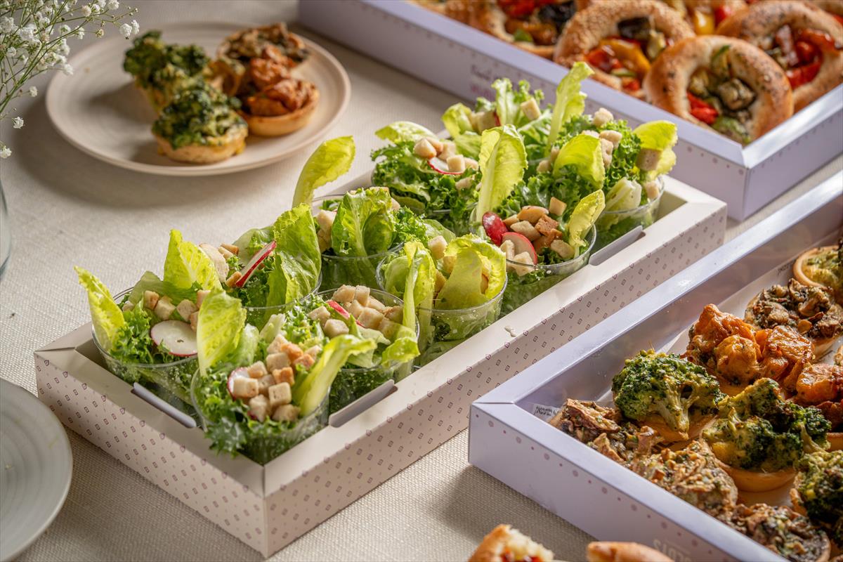 A tray of Caesar salad & croutons