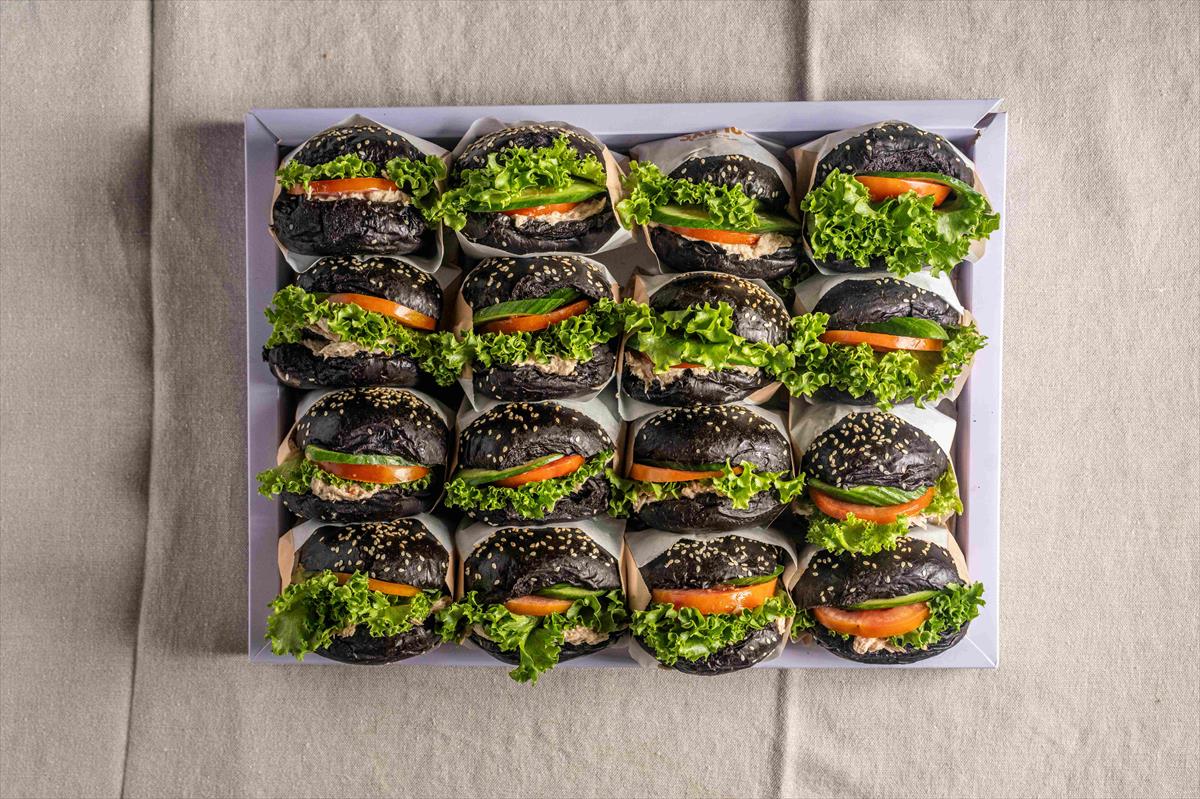 A tray of tuna sandwiches in Kalamata flute bread