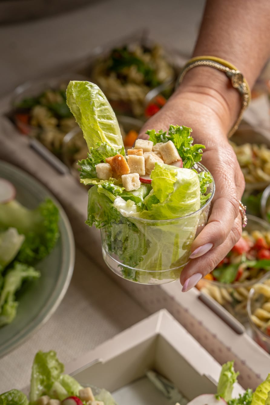 A tray of Caesar salad & croutons