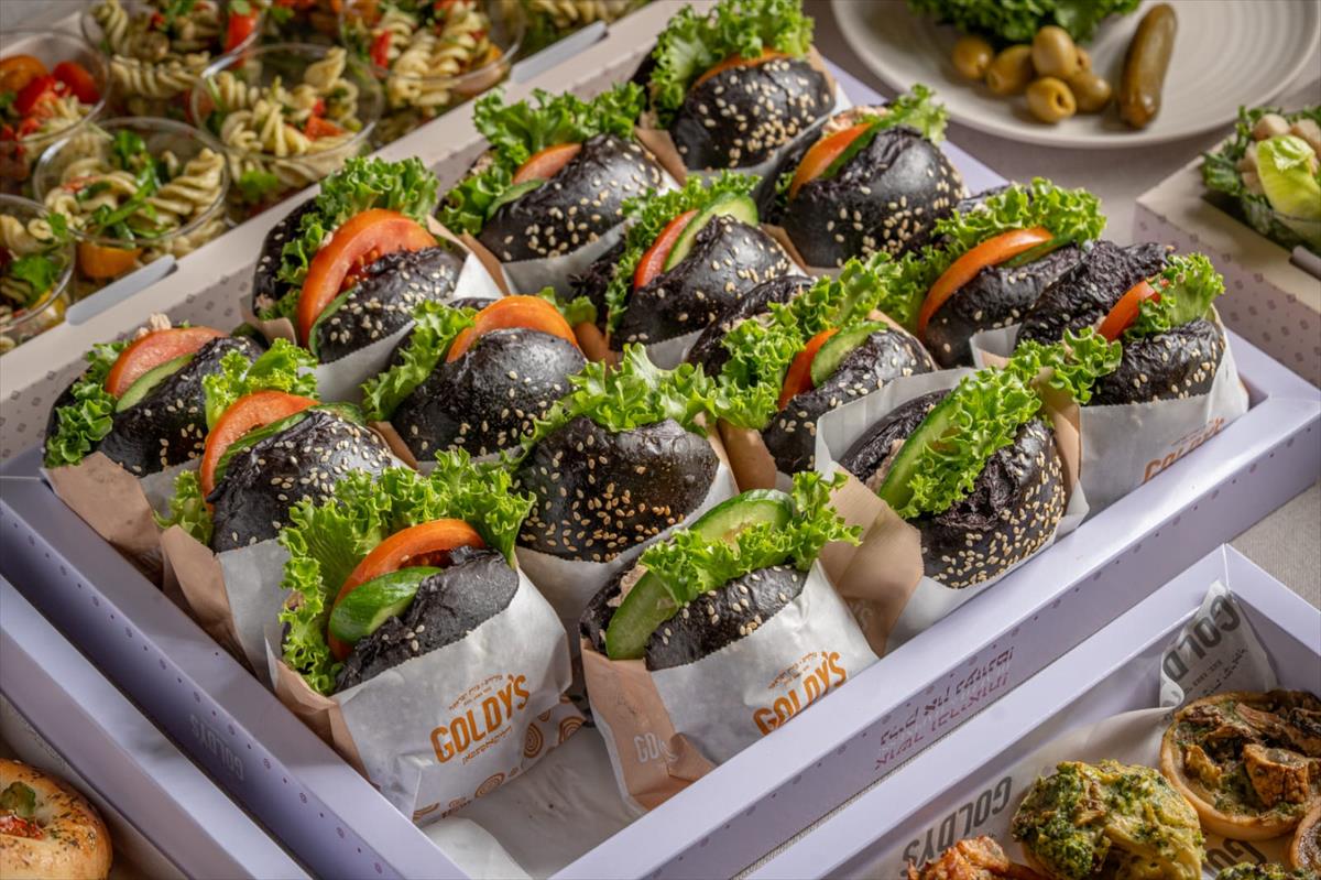 A tray of tuna sandwiches in Kalamata flute bread