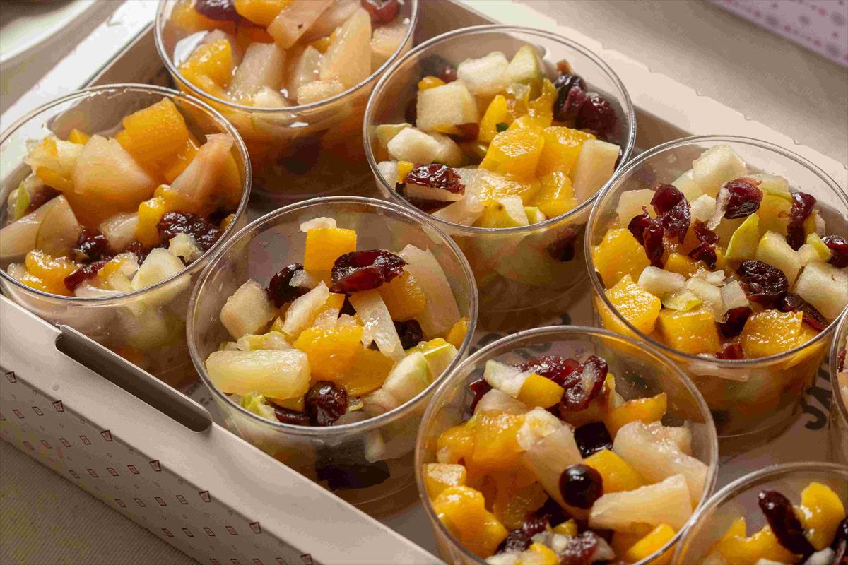 A tray of fruits & pecans salad cups