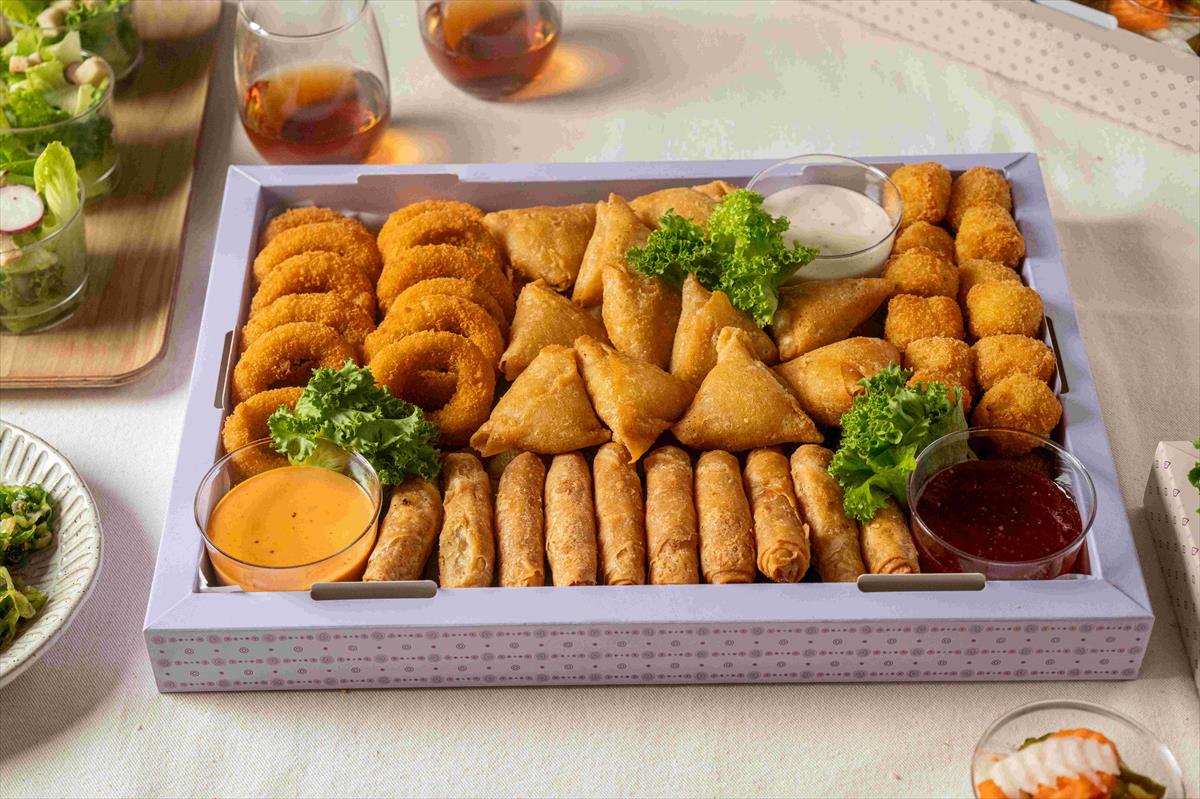 A tray of fried dumplings + condiments