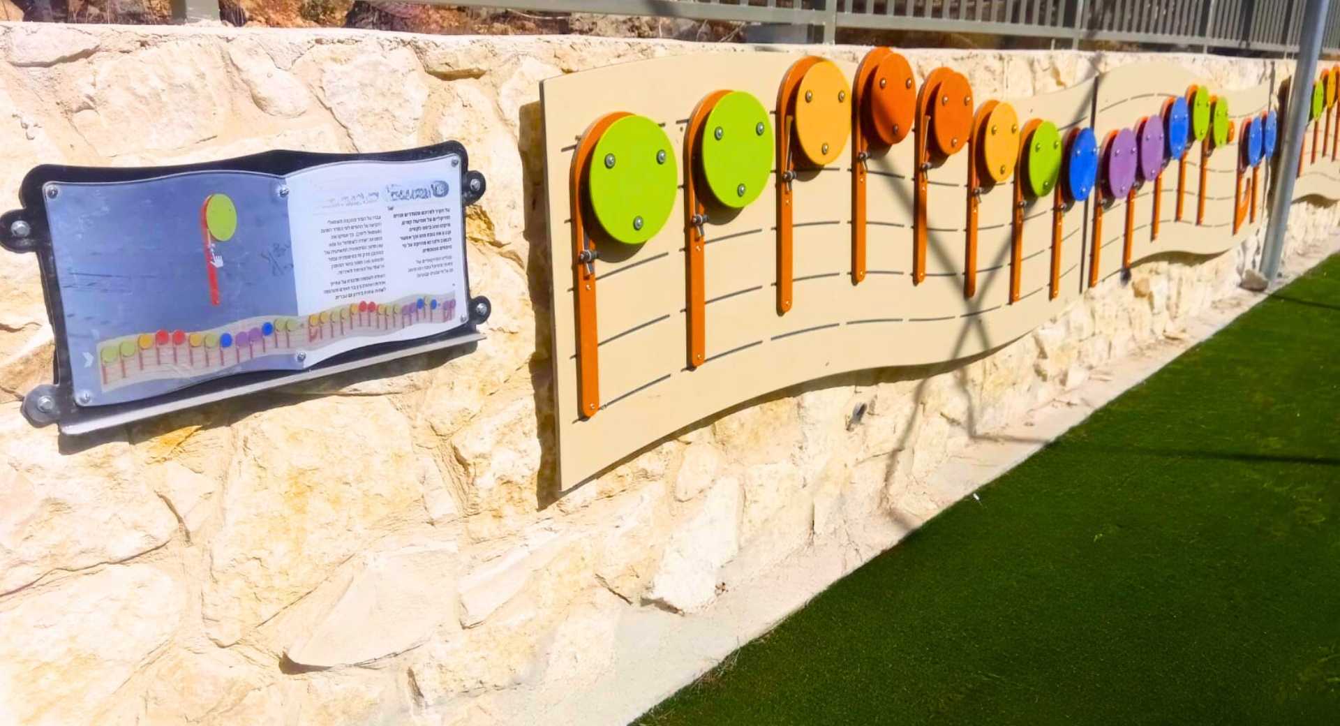 Designing a Musical Playground for the Public Realm - A Large All-Ages Play and Sound Space