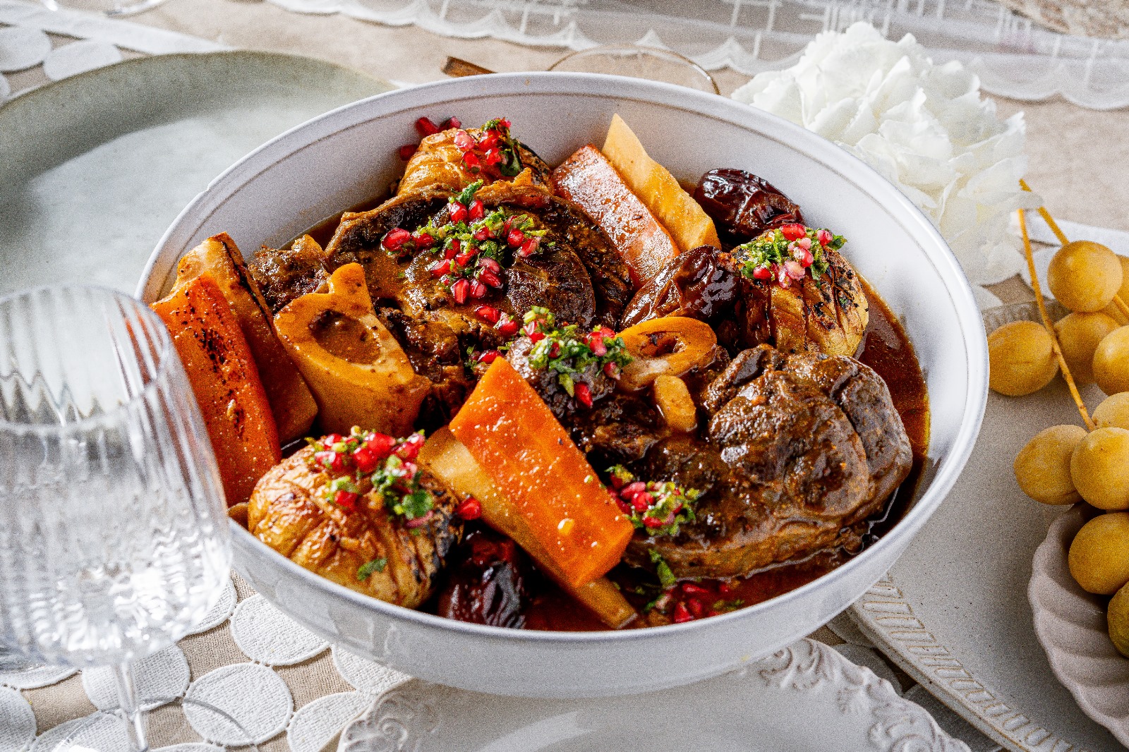 Osso Buco braised in wine broth with dried fruits.