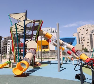 Central Adventure Play Structure in a Public Playground